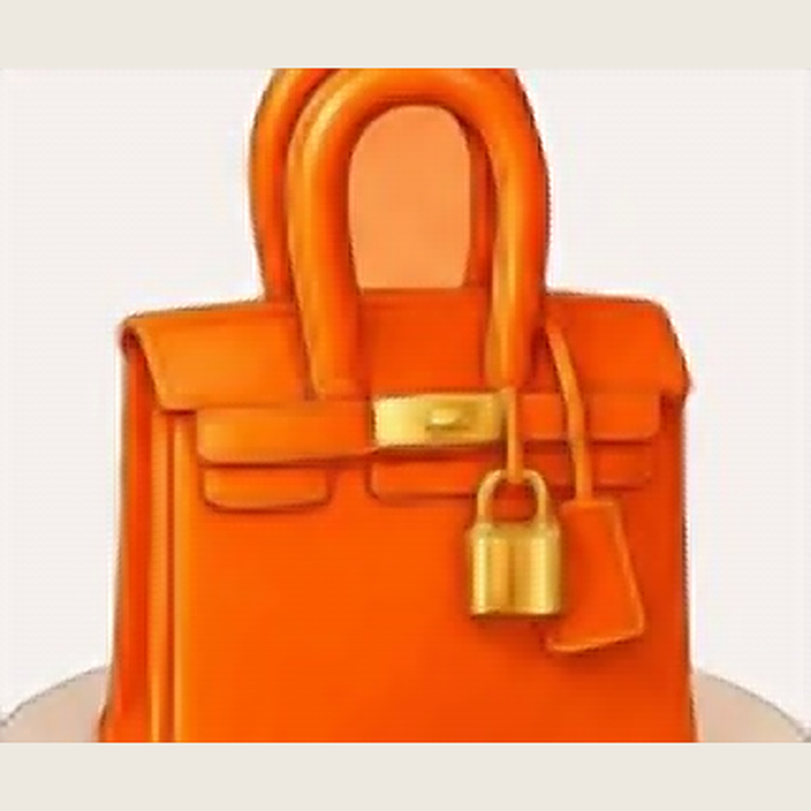 Orange designer handbag-shaped cake inspired by the Hermès Birkin